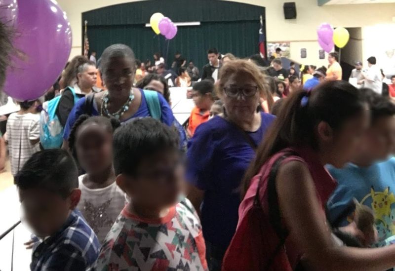 Students and parents gather at a PBIS school event